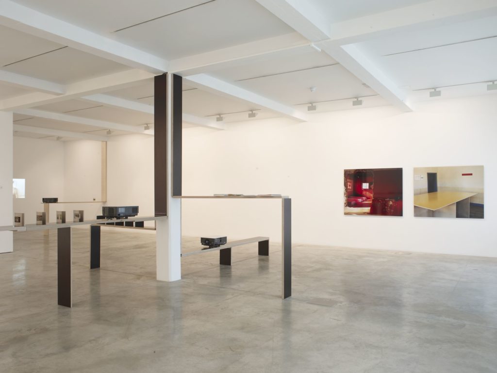 Narelle Jubelin and Marcos Corrales, Owner Builder of Modern California House 2, 2001-2008 (left), and Ângela Ferreira, Double Sided (Parasol), 1996-2008 (right), installation view at Parasol unit, London, 2008. Photography by Stephen White
