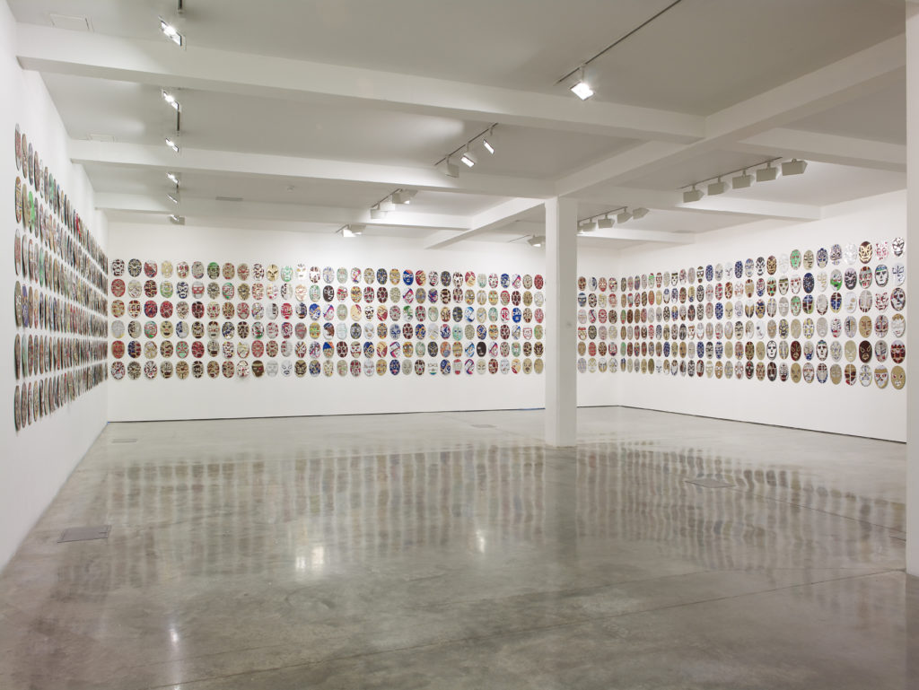 Adel Abdessemed, silent warrior, 2010. Cans; 804 masks, each mask approx: 29 x 20 cm. Installation view at Parasol unit, London, 2010. Courtesy of the artist and David Zwirner, New York. Photography by Stephen White
